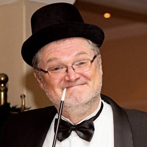 Gary Hemmings in top hat and bow tie on stage